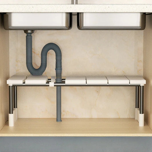 Pipe dodging under sink shelving